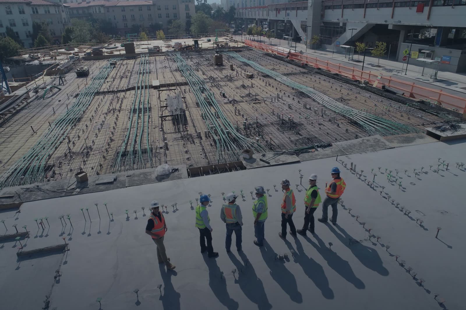 Reinforced concrete slab and services being laid on a BAWE building site