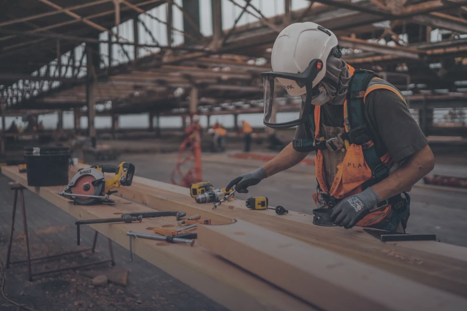 A BAWE tradesman fixing timber shuttering on site
